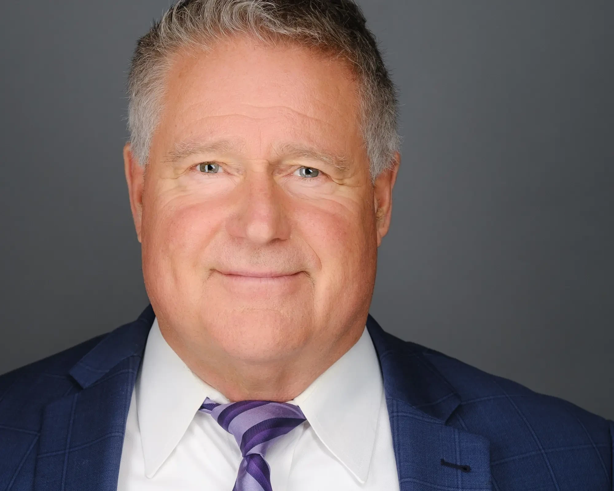 Professional headshot Calgary studio - executive business portrait navy suit